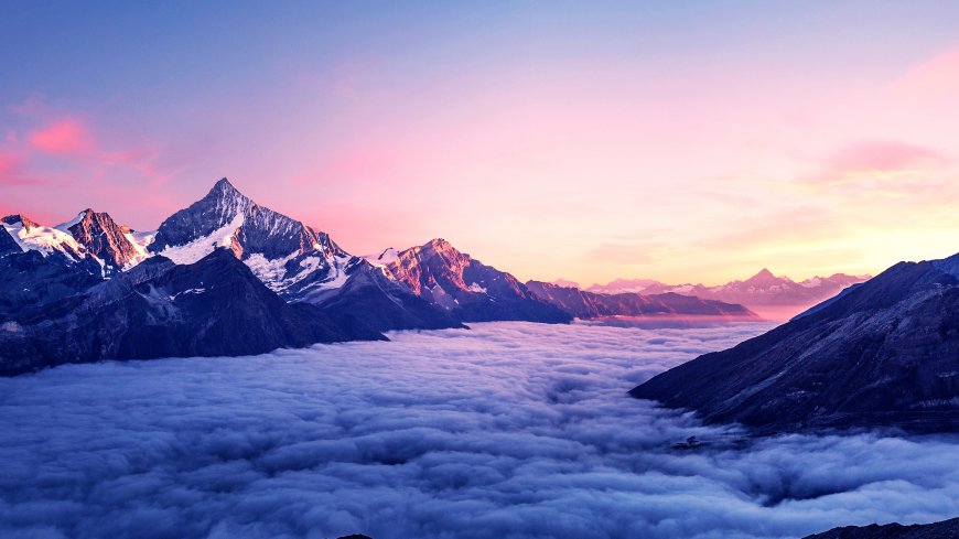 阿尔卑斯山日出云海雪山风光电脑壁纸