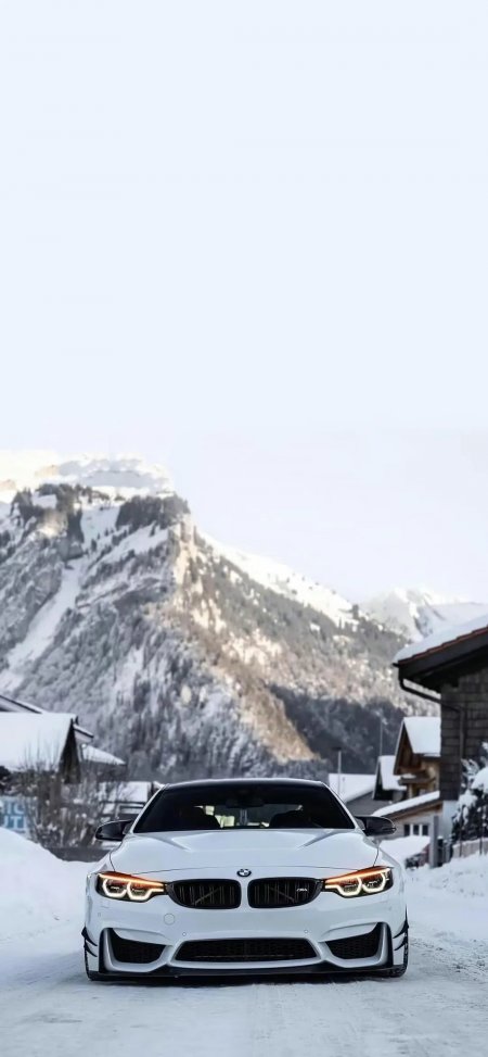 宝马M4白色高性能轿跑雪景山路手机壁纸