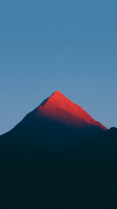 日出时分赤红山峰剪影手机壁纸