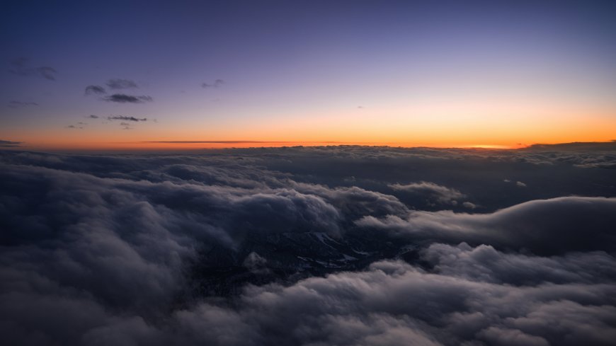 云海日出山峦剪影橙紫渐变壮丽自然风景电脑壁纸