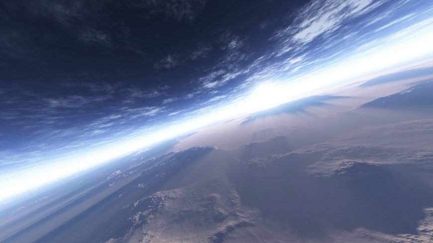 高空俯瞰地球云海与阳光壮丽太空风景电脑壁纸
