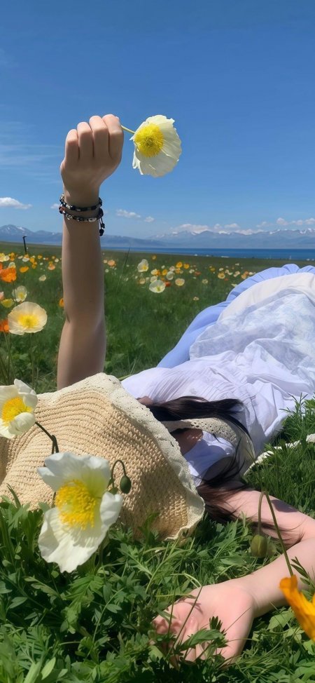 花海中躺卧举白花美女自然风光手机壁纸