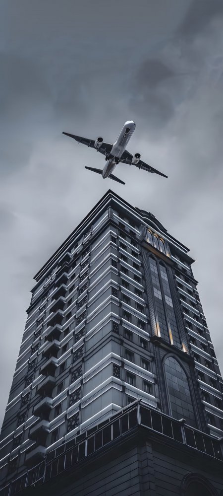 飞机飞越高楼城市建筑创意手机