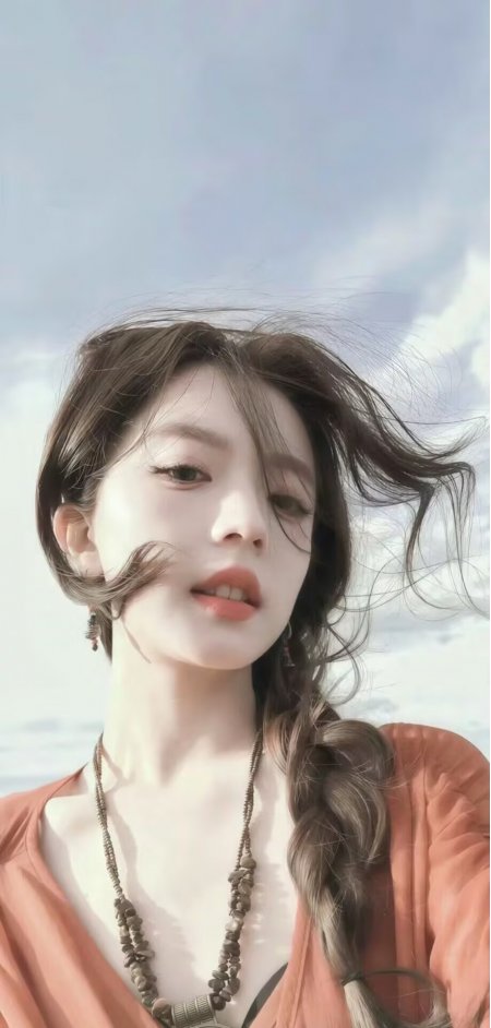 棕发美女橙色开衫海边编发展现自然风情人物手机壁纸