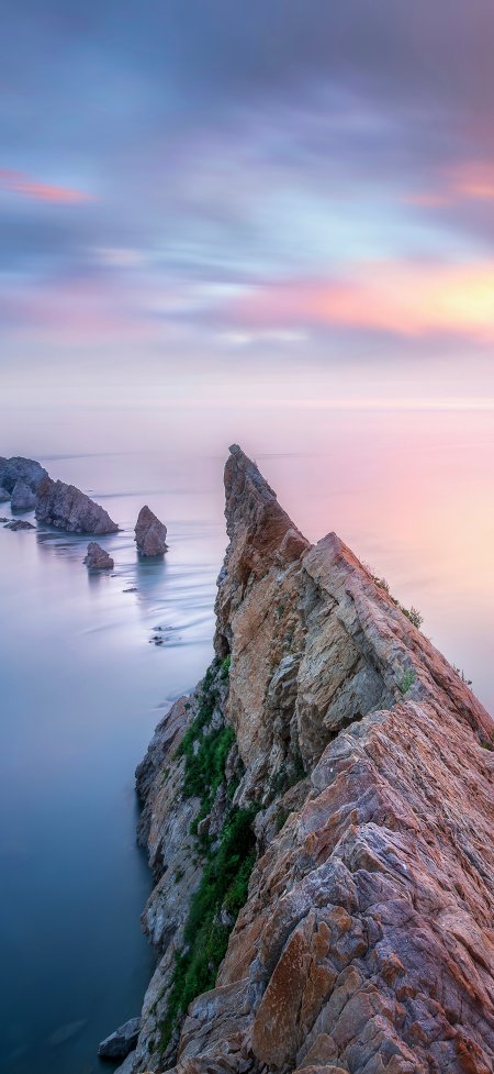 海边岩石山峰日落风景手机壁纸