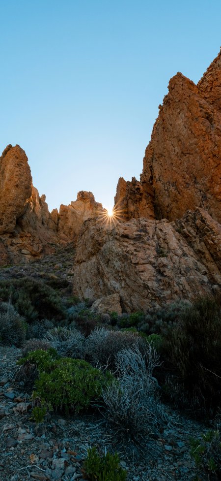 荒漠岩峰日出星芒万丈壮丽峡谷风光风景手机壁纸