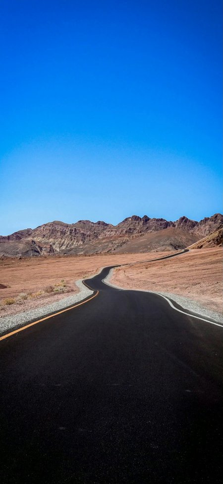 荒漠公路延伸向远山壮阔西部风光风景手机壁纸