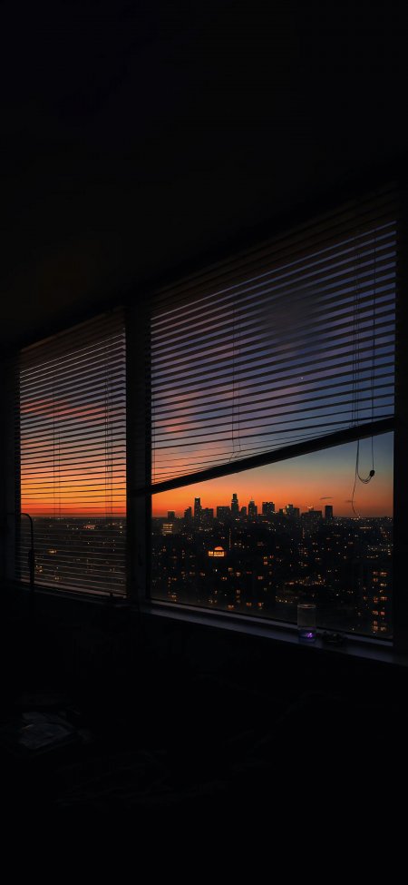 百叶窗透晚霞城市夜景剪影治愈系风景手机壁纸