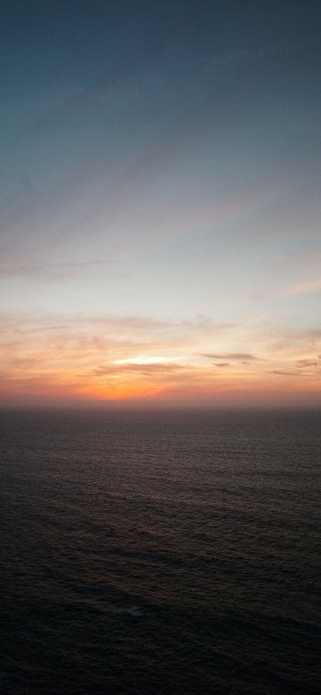 大海落日橙霞暗浪静谧风景手机壁纸