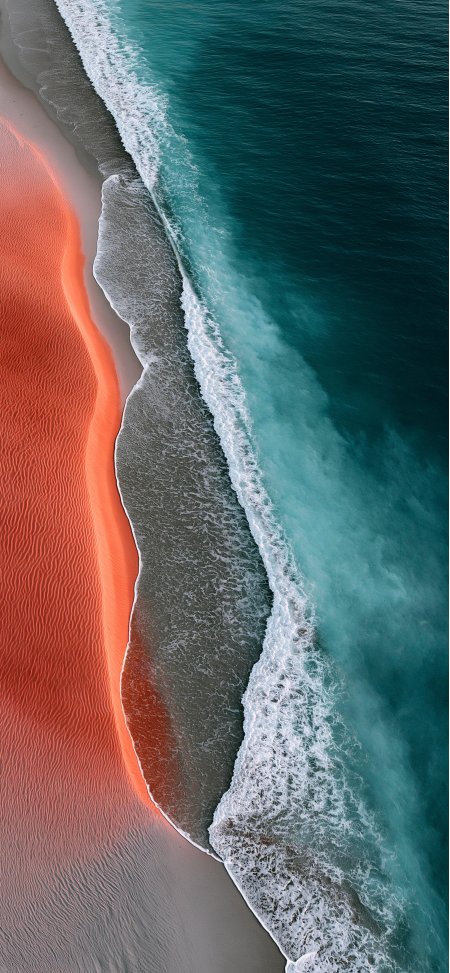 橙沙丘碧海航拍撞色风景手机壁纸
