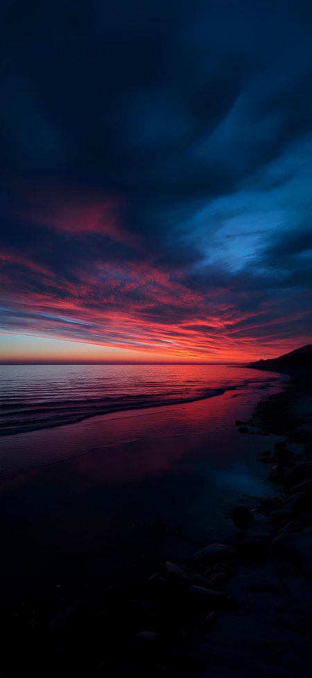 深蓝海面火红晚霞礁石壮丽日落风景手机壁纸