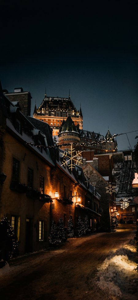 魁北克雪夜古堡街景风景手机壁纸