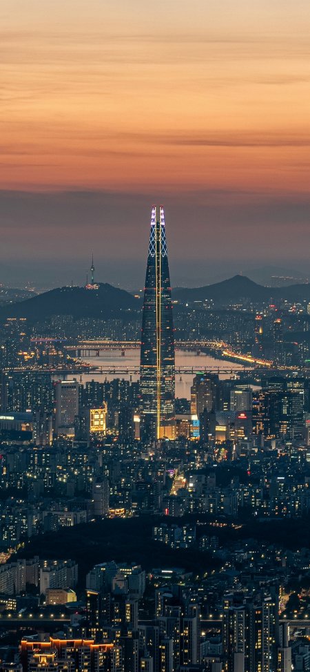首尔乐天世界塔黄昏城市夜景灯火辉煌风景手机壁纸