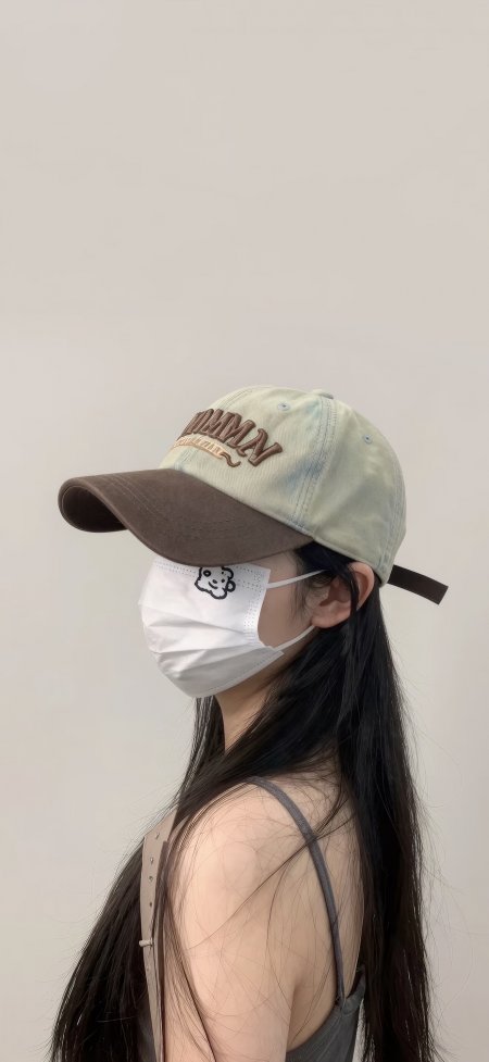 戴帽口罩少女侧颜浅绿棕调人物摄影手机壁纸