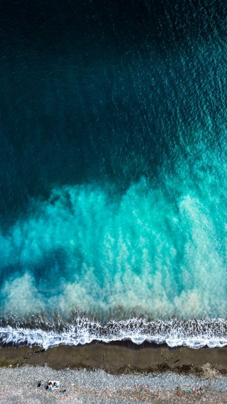深蓝海浪拍岸白沫青绿风景手机壁纸