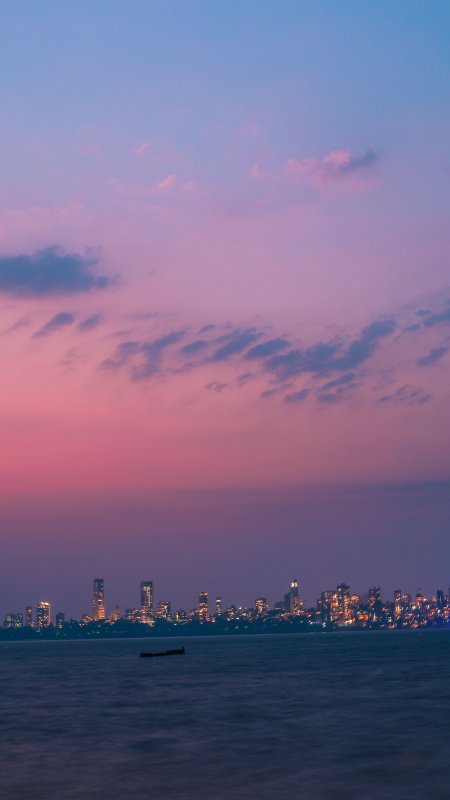 城市天际线灯火辉煌粉紫渐变风景手机壁纸