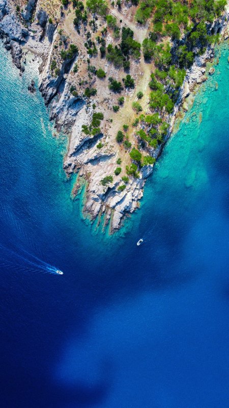 碧海悬崖绿植点缀蓝绿风景手机壁纸