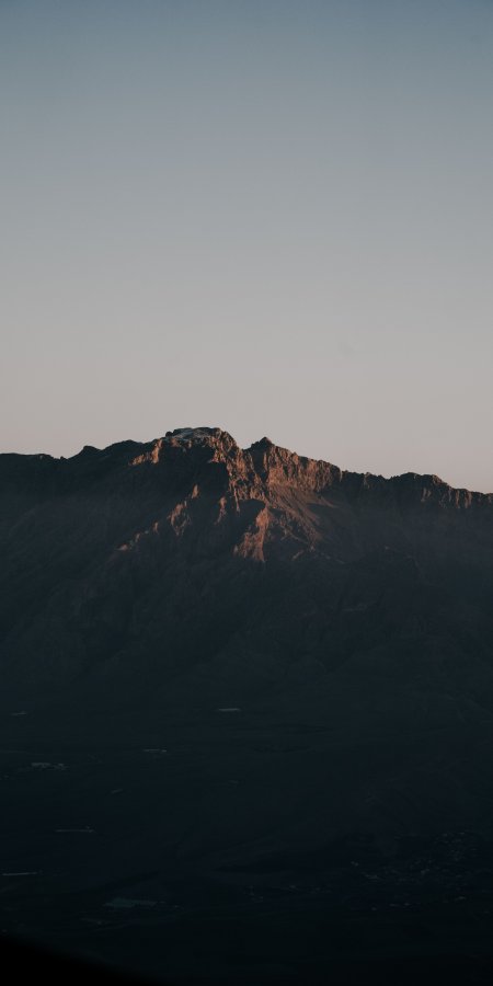 巍峨山峰夕照金边蓝灰风景手机壁纸
