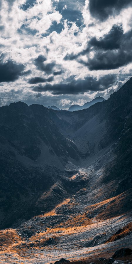 巍峨山谷光影交错蓝灰风景手机壁纸