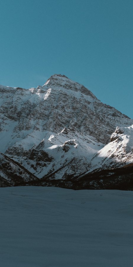 雪山巍峨雪覆岩壁蓝白风景手机壁纸