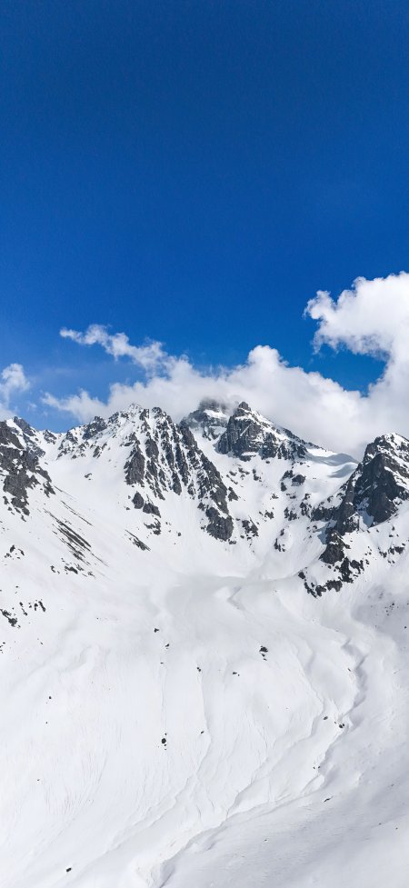 雪山巍峨雪谷蜿蜒蓝白纯净自然风景手机壁纸