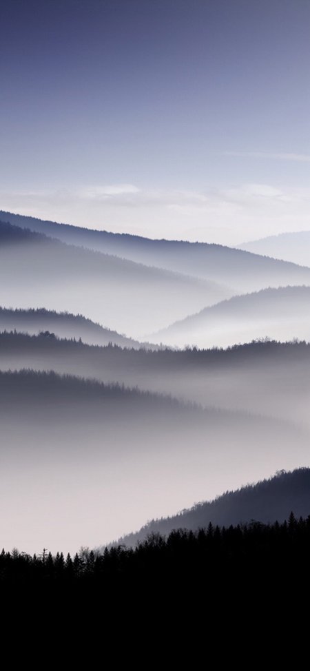 层峦叠嶂云雾缭绕山林静谧蓝灰自然风景手机壁纸