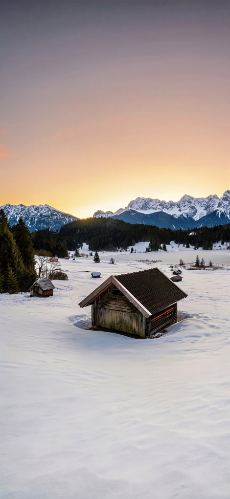 雪山脚下木屋静立雪原橙紫渐变风景手机壁纸