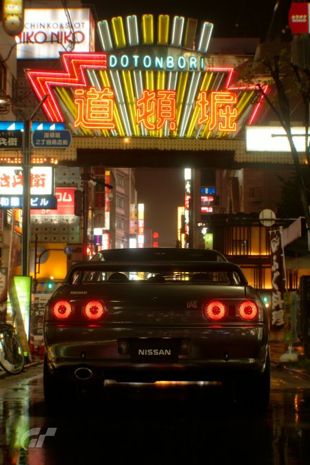 日产GTR黑色跑车雨夜霓虹街道汽车手机壁纸