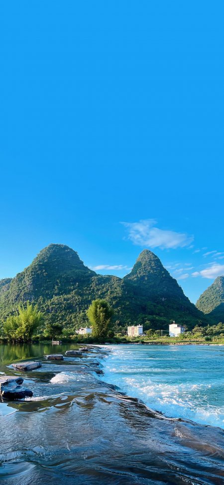 桂林漓江喀斯特峰林碧水石坝蓝空风景手机壁纸