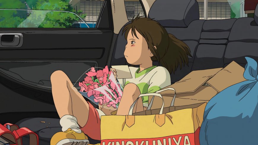 千与千寻荻野千寻车内坐姿手捧粉花绿白少女动漫电脑壁纸