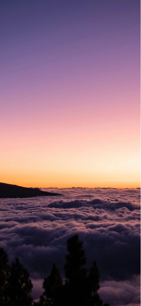 云海日出渐变紫橙天空山影剪影风景手机壁纸