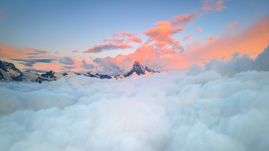雪山云海日出霞光粉橙蓝白风景电脑壁纸